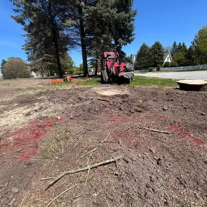 Stump grinder at work on a freshly ground area in Manistee, MI
